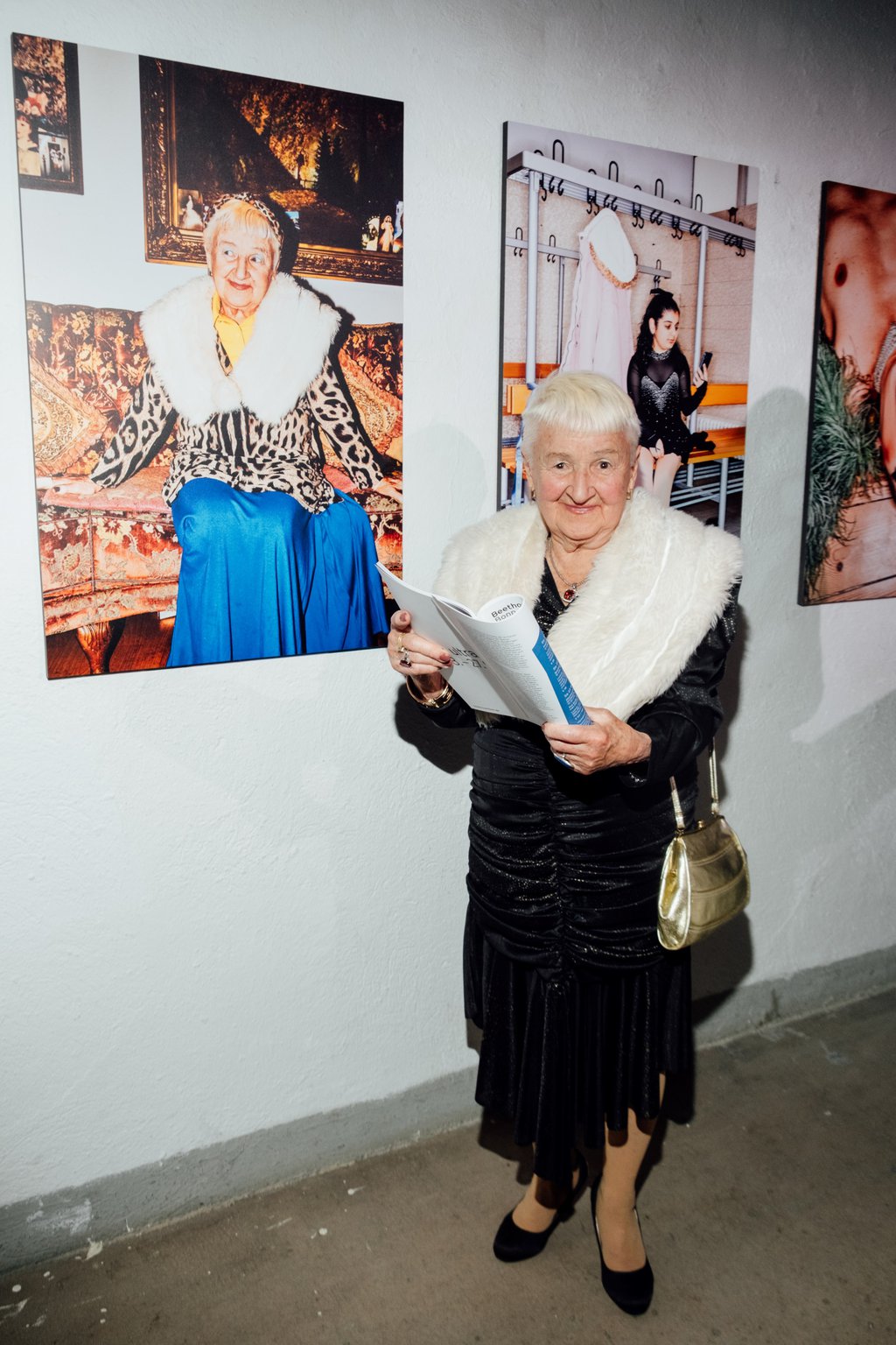 TikTok grandma Kristiana poses in front of her portrait by Patrick Essex. - © Nekame Klasohm